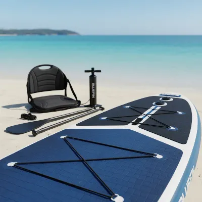 Detailed shot of Bluefin Cruise Carbon paddle board deck showing features like deck pad, D-rings, and accessories nearby